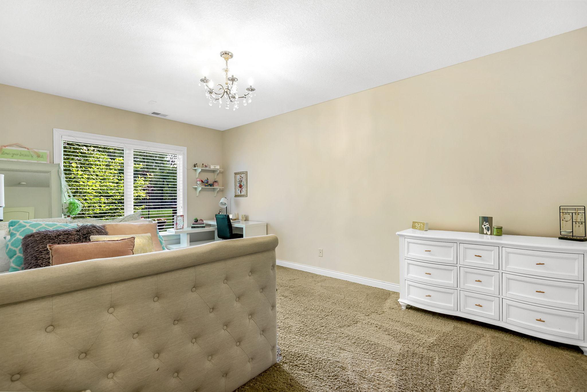 Lower level has 2 bedrooms – 1st lower level bedroom with large window, in-floor heating, and walk-in closet