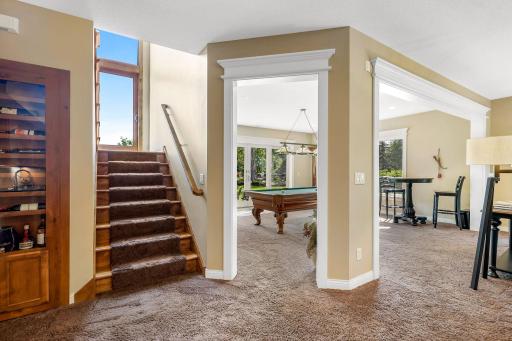 Massive walkout lower level with an entertainment area, billiard room, 2 spacious bedrooms, additional office/study area, a full bathroom, a gym, in-floor heating throughout - and an entirely separate wing with a Mother-in-Law suite!