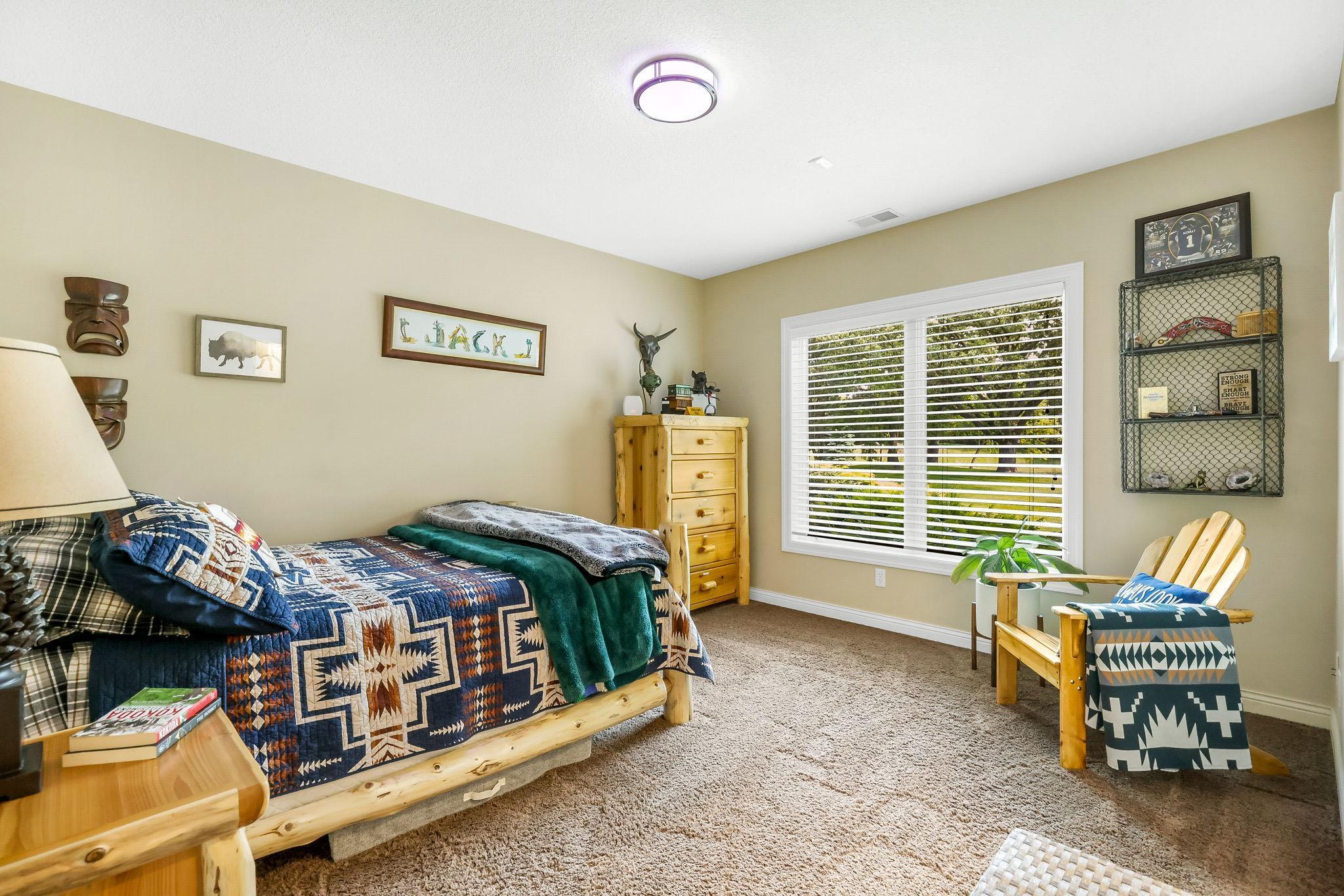 Lower level has 2 bedrooms – 2nd lower level bedroom with large window, in-floor heating, and walk-in closet