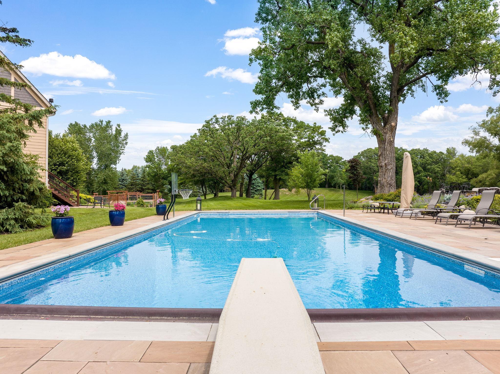 Jump in and enjoy - 50x20 heated pool with an automatic cover.