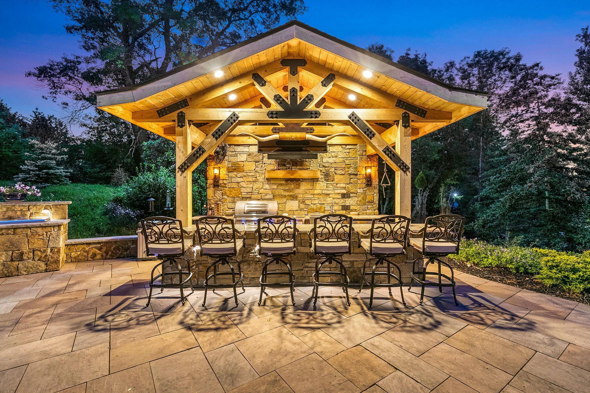 Incredible natural stone outdoor kitchen bar area - a space that no one will ever want to leave!