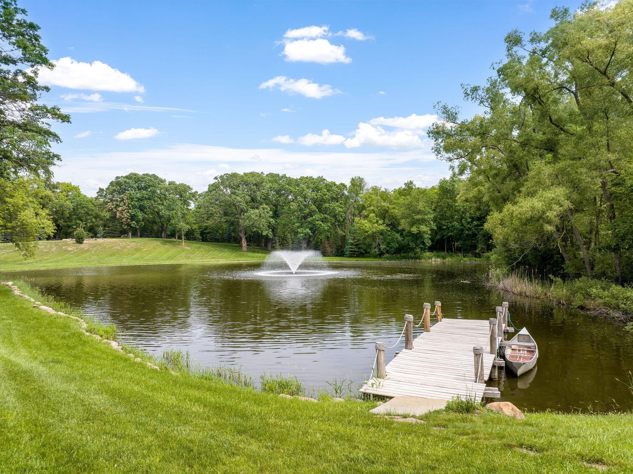 Large pond with fountain and dock - beautiful in the summer and a private skating rink in the winter!