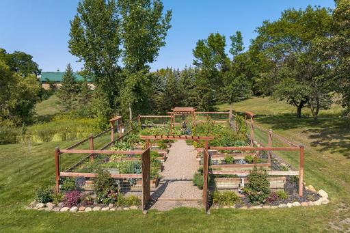 The self-watering organic garden is something most can only dream of â elevated beds, self-irrigation system, and high fencing to keep out deer and rabbits - all come together to create a low-maintenance and high producing outdoor garden!