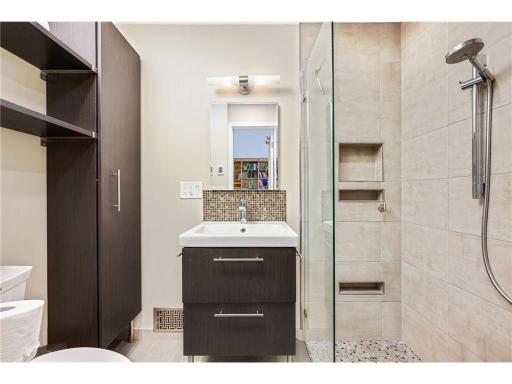 A nicely updated 3/4 bath in the primary suite including a heated floor
