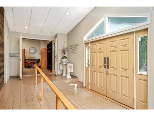 Front entry with an accessible ramp leading to the gathering area