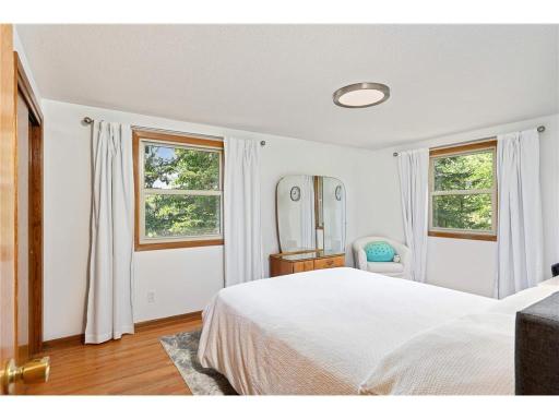 Upper level bedroom three brings the outdoors in through the windows