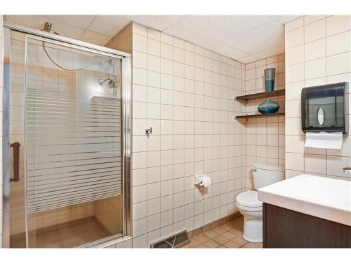 3/4 bathroom is located just off the dining area in the lower level