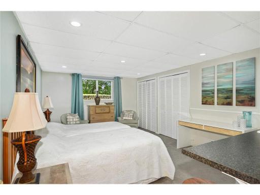 This bedroom is in the lower level includes a kitchenette
