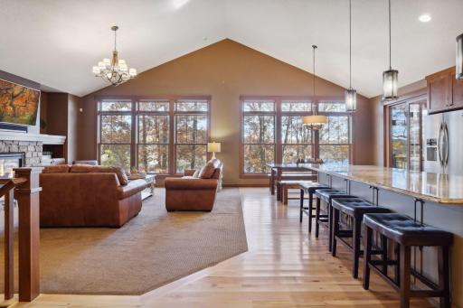 The entryway flows seamlessly into the open floorplan, connecting the living room, kitchen, and dining areas.