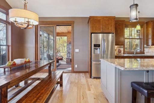 Designed for gathering, this inviting dining room seamlessly connects to the kitchen and living room, making it perfect for entertaining.