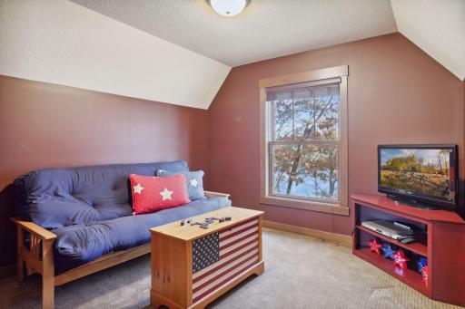 The lounge area, ideal for watching movies or playing video games, features a futon that easily converts into extra sleeping space.