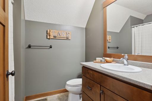 This well-appointed bathroom combines functionality and comfort, perfect for family or guests.