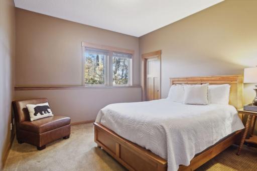 The lower level also features two comfortable bedrooms, thoughtfully designed to offer privacy and relaxation for guests.