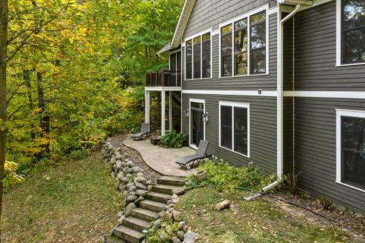 The spacious patio is easily accessible from the walkout lower level or the deck stairs, offering a seamless flow between indoor and outdoor living.