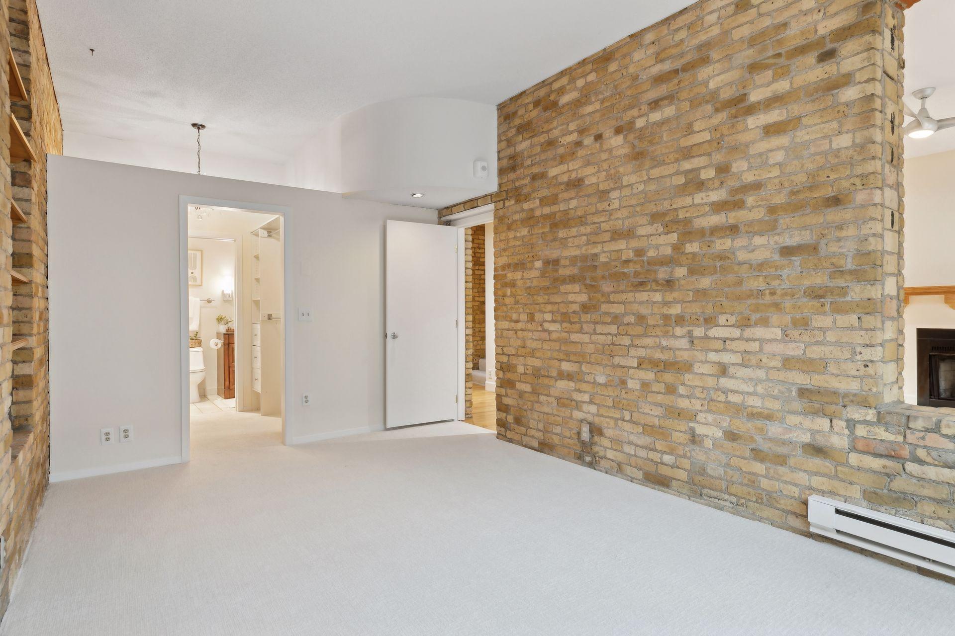 Walk-in closet leads to full Bath