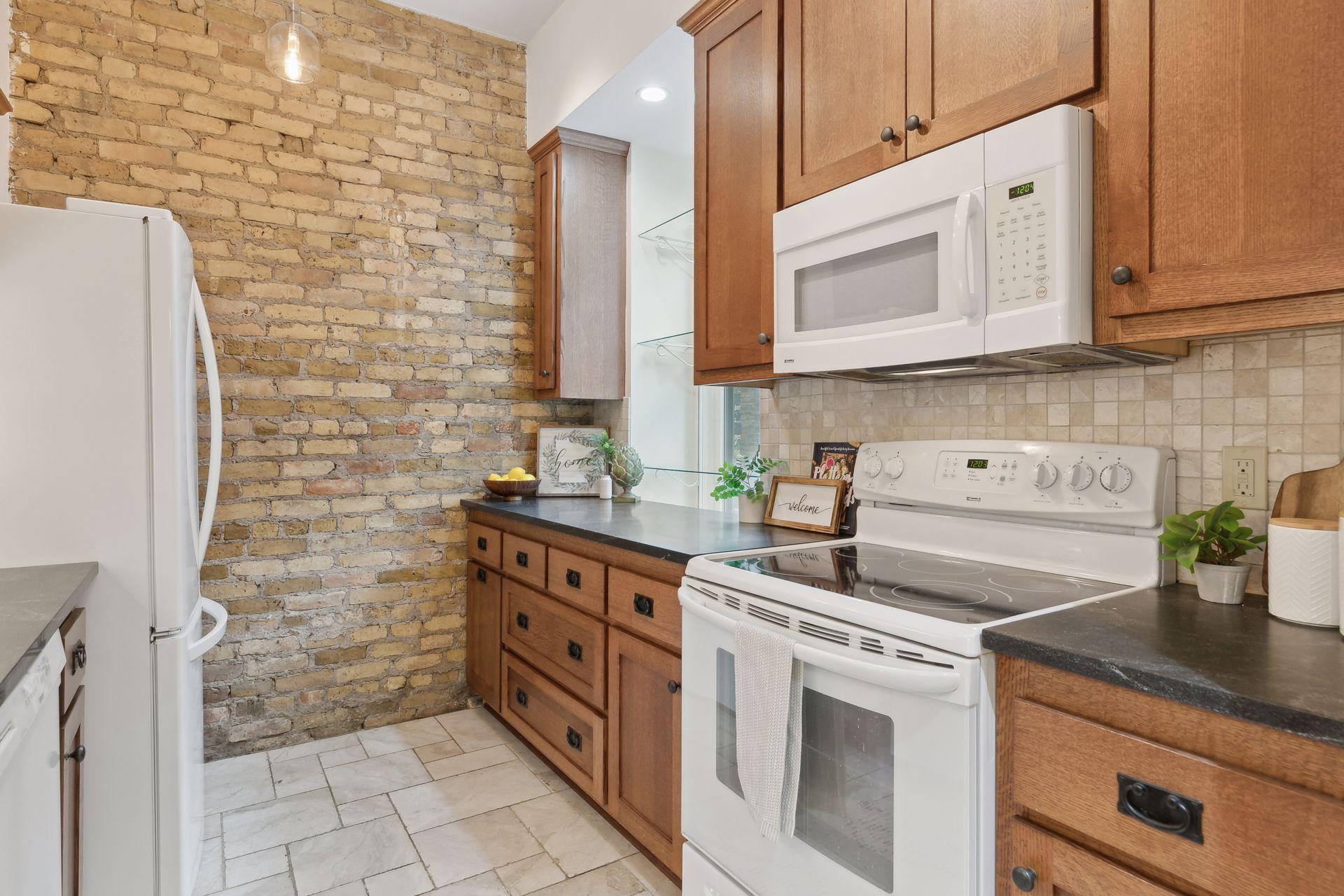 Large kitchen window with glass shelving
