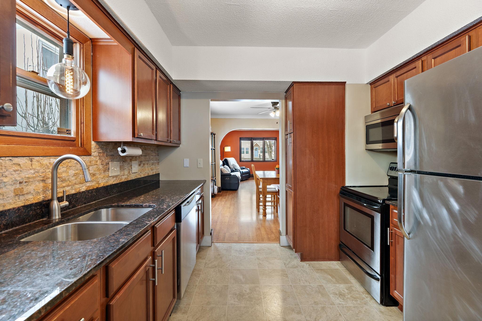 The kitchen is conveniently located next to the dining room.