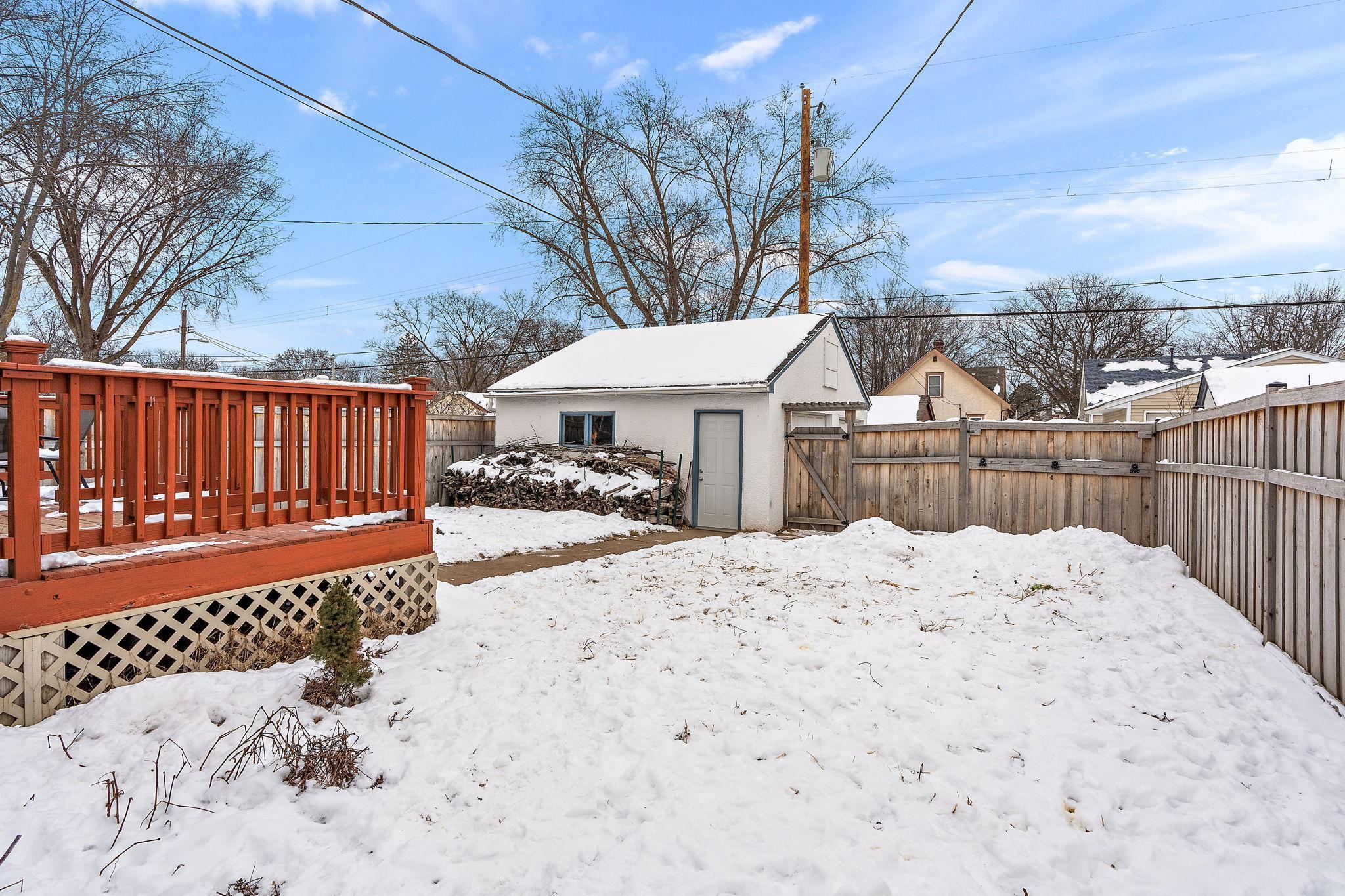 The backyard has a 6 foot cedar privacy fence and a detached garage.
