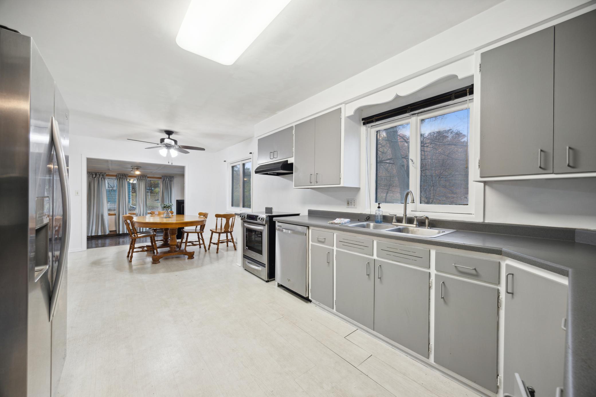 Kitchen with stainless appliances. There is an abundance of cabinets and a lot of counter space.