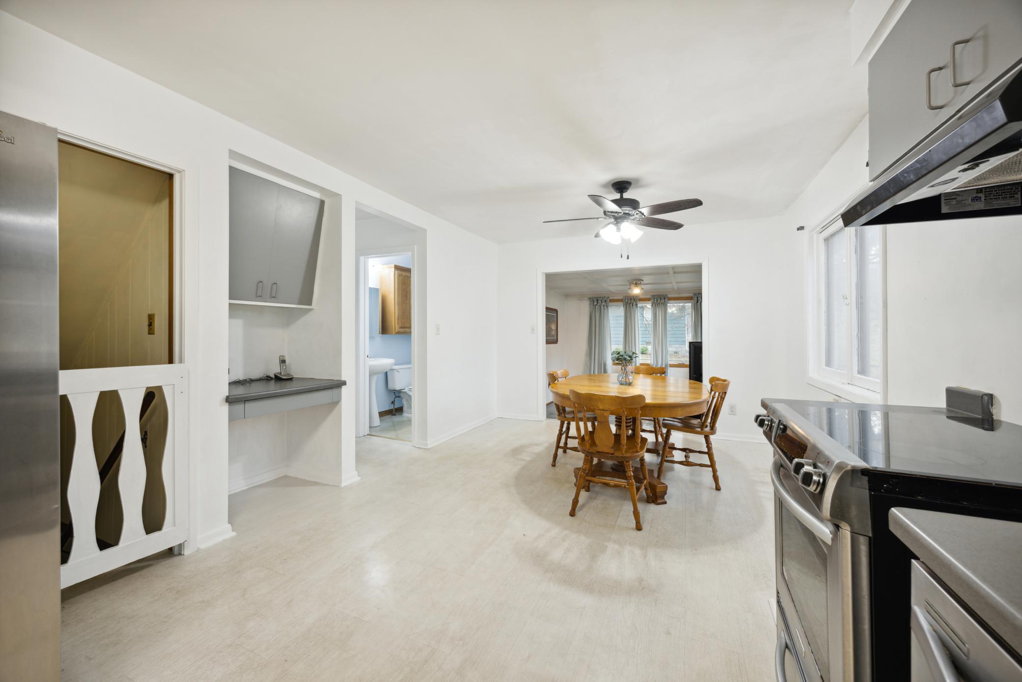 Dining area leads into the sunroom.
