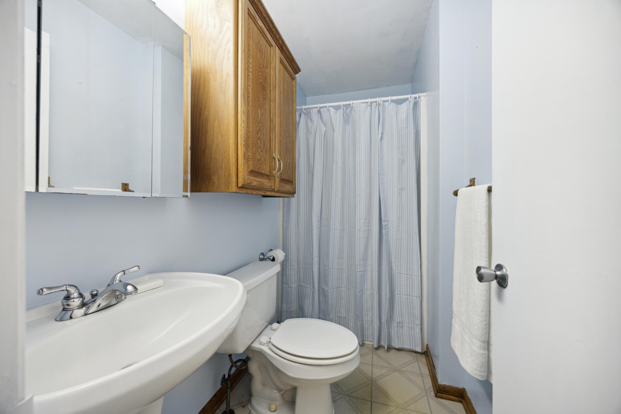 Main floor 3/4 bath is so handy and freshly painted.