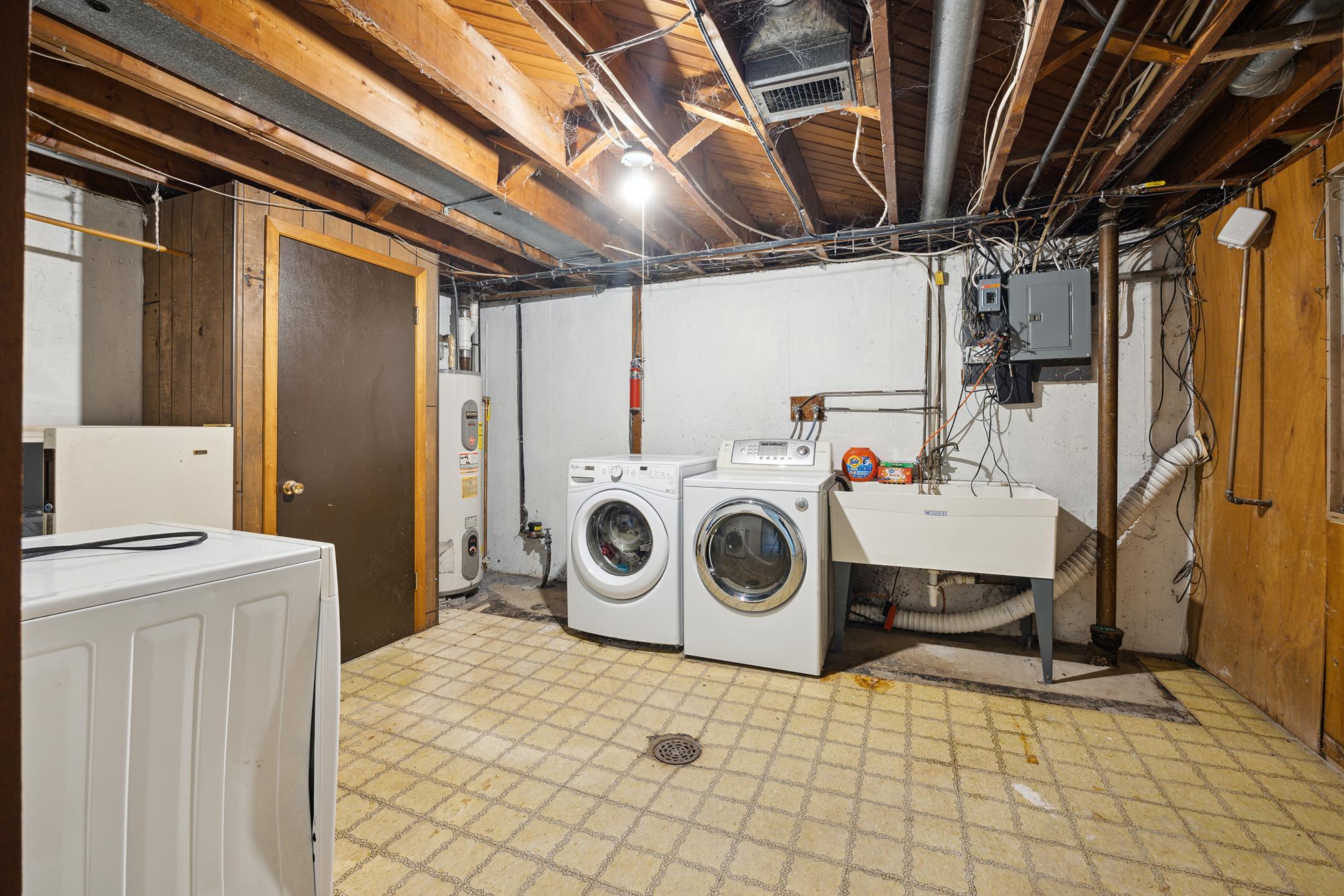 Laundry room has a newer washer/dryer. There is also a door to the back yard from this room.