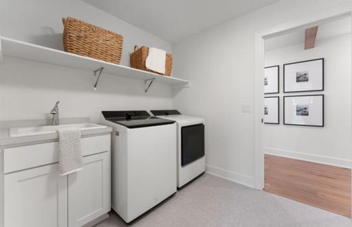 Dream Home Laundry 1.jpegoom or hall features washer, dryer, cabinetry, sink, folding counter and hanging space.