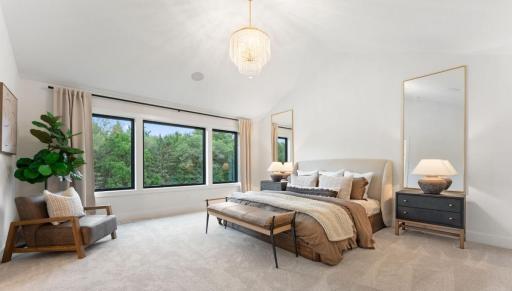 Tranquil owners retreat with vaulted ceiling and large windows to maximize natural light and views of this breathtaking setting.