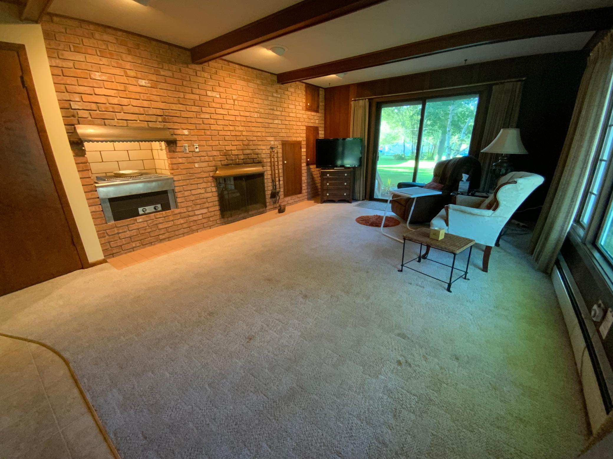 Family room with wood burning fireplace and indoor grill/pizza oven!