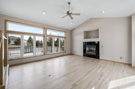 A bright and spacious living room filled with natural light from expansive windows