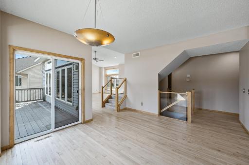 Dining Room & Stairs to Lower Level & Upper Level