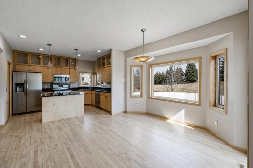 Adjacent to the stunning kitchen, the elegant dining area offers a seamless blend of style and functionality, perfect for intimate meals or lively gatherings.