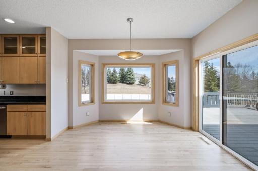 Step from the elegant dining area onto a spacious deck, perfect for outdoor entertaining and relaxing.