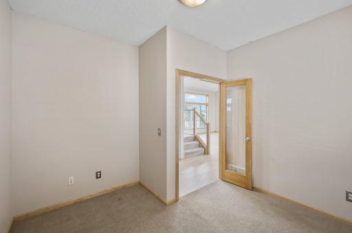 Main level Office with beautiful glass and cedar double doors.