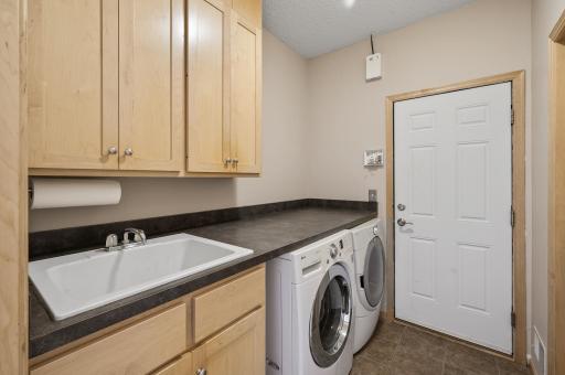 Main level laundry with a large deep sink.