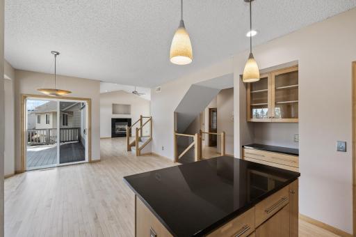 16 The beautiful kitchen has a great view of the dining room, living room and deck.