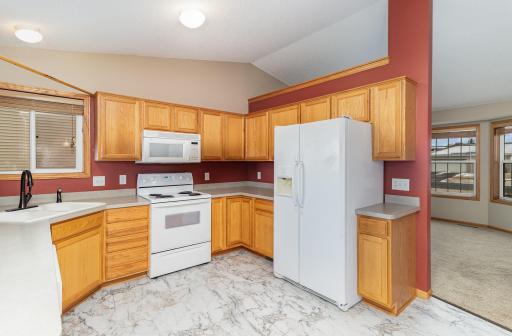 corner sink with window and plenty of cabinets in the kitchen
