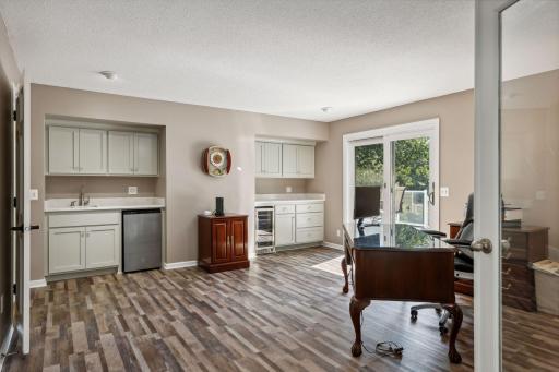 Owner's Suite's adjoining Flex Room walks out to Deck & pool area.