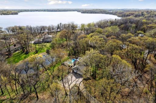 This spectacular home is just steps away from Pleasant Lake! Resident-only beach area with picnic tables, grills, dock, playsets & a 5+mile trail around the lake.