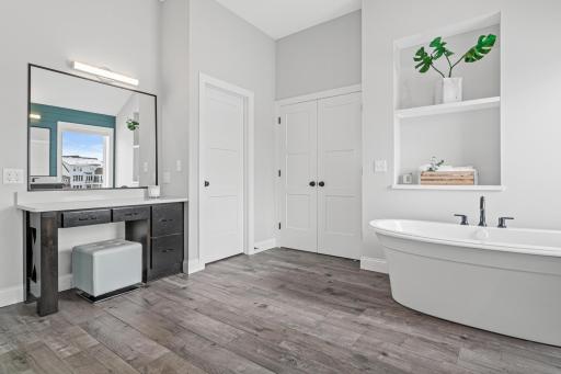 Double doors off the primary into the bathroom, built in shelving and peaked ceilings give it a luxurious step up!