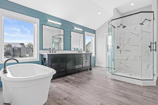 You'll love the primary bathroom! Dual shower, large tub and extra counter space.