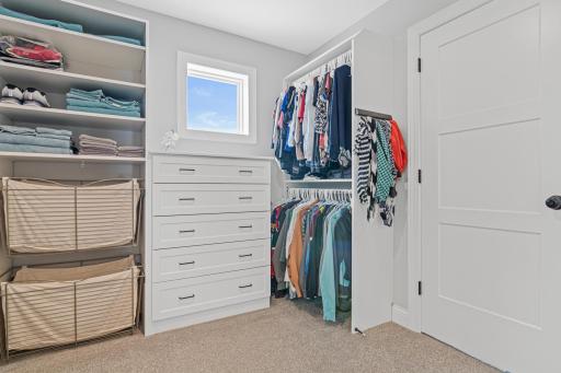 This home offers multiple walk in closets with ample drawers and storage