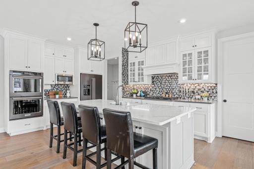 The kitchen tile offers the perfect amount of eye-catching glam