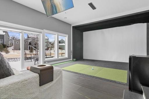 A golfer's dream! Custom built for the space, this golf simulator is top of the line! Full Swing.