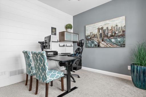 Office #1 on main level with custom shiplap wall (could also be used as a den, sitting room, game room, kids flex room for home schooling,etc)