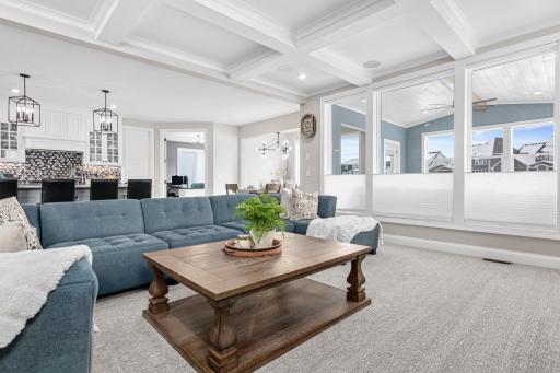 Main living room with large windows- grabs all the light shining in from the sunroom