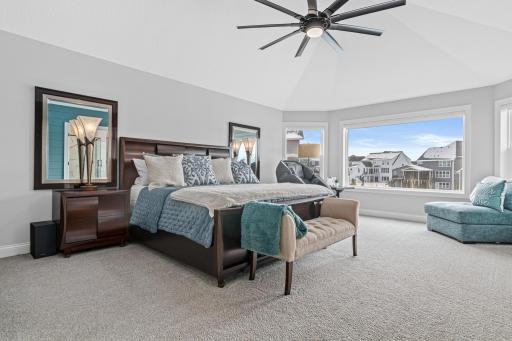 Primary Bedroom with oversized windows and arched ceiling