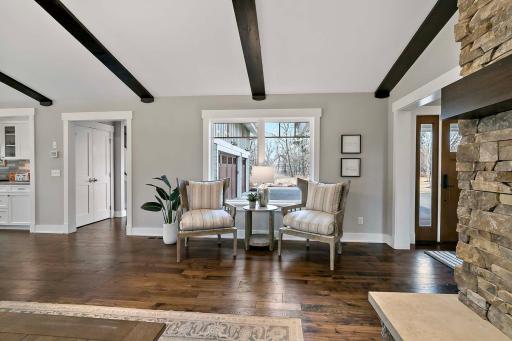 Enjoy comfort and convenience in this cozy seating area, with a lovely view of the driveway.