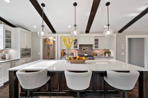 A stunning, oversized kitchen island that transforms the kitchen into a hub for cooking and conversation.