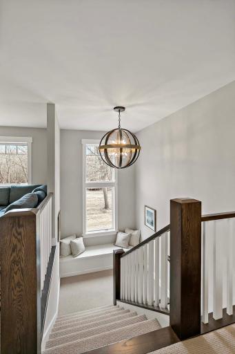 Elegant stairs leading to the upper-level living space, offering a seamless flow and added privacy.